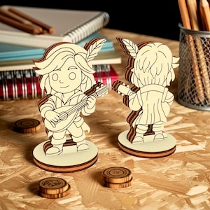 Front and back view of laser cut bard tabletop miniature, wooden fantasy RPG character with musical instrument