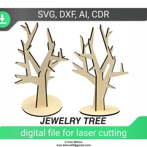 May include: Two wooden jewellery tree stands with branches for hanging earrings, necklaces, and bracelets. The stands are made of laser-cut wood and are available in SVG, DXF, AI, and CDR file formats.