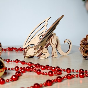 Glowforge dragon laser cut file, ideal for creating unique wooden Christmas ornaments
