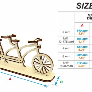 May include: Tan wooden tandem bicycle model with black wheels. The model is on a base with measurements labeled A, B, and C. A chart shows the dimensions of the model in millimeters and inches for different material thicknesses.