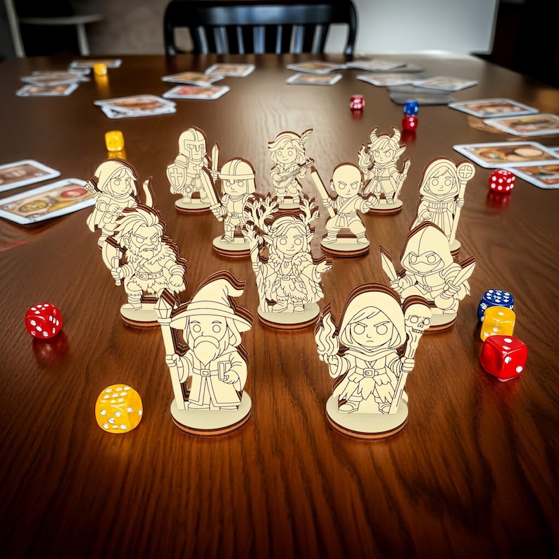 Complete set of wooden fantasy RPG miniatures arranged on tabletop, laser cut characters with dice and cards for board games