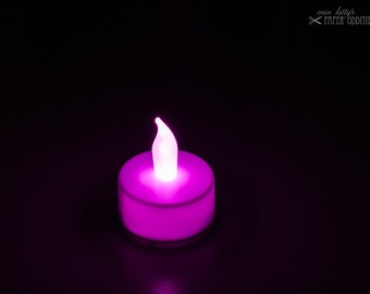 LED tealight with pink flame