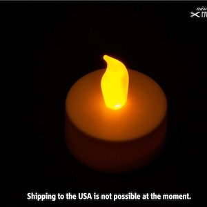 LED tealight with yellow-orange flame