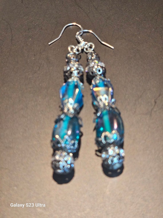 Turquoise earrings mixed with antique silver rhinestone beads.