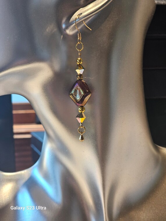 Iridescent purple with purple  chystals earrings.