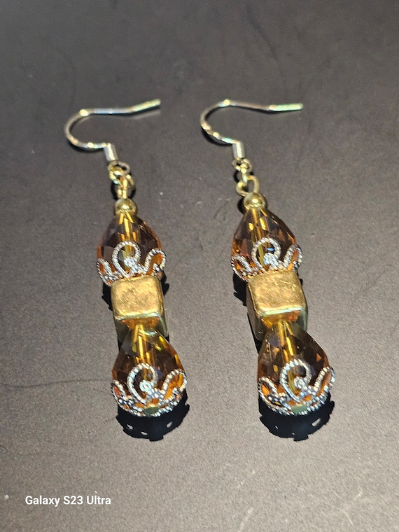 Yellow Gold Crystal with gold center square earrings.
