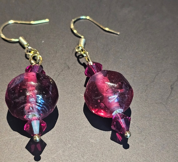 A small Swarovski crystal with iridescent fuchsia glass beads drop earrings.