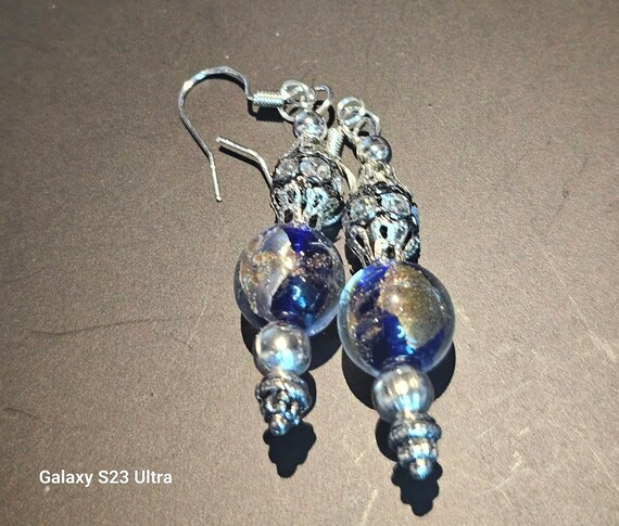 It looks like the world was imprinted on this lovely beaded earrings