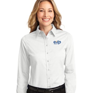 May include: A white long-sleeved button-down shirt with a blue and yellow logo that says "exp realty" on the right chest.
