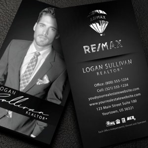 May include: Black and silver business card with a hot air balloon logo for RE/MAX. The card features the name Logan Sullivan, Realtor, with contact information and a physical address.