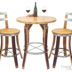 May include: A wine barrel table set with two chairs. The table top is made of reclaimed wood and the chairs are made of wine barrels. The table has a metal base and the chairs have metal footrests. The set is perfect for a small space or a cozy corner.