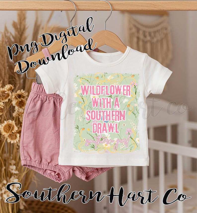 May include: A white t-shirt and pink shorts set for babies. The shirt features the text "WILDFLOWER WITH A SOUTHERN DRAWL" in pink and green, with floral accents. The words "southern girl" are also included. The words "Png Digital Download" and "Southern Hart Co" are also visible.