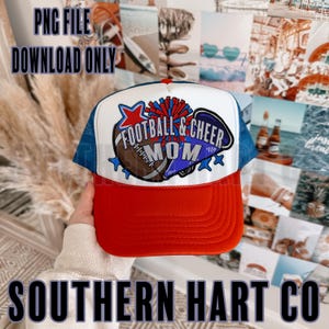 May include: A white and red trucker hat with a blue mesh back. The hat features a graphic of a football and a cheerleader with the text "Football & Cheer Mom".