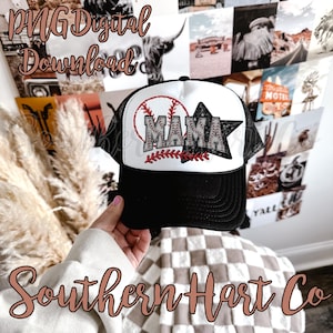 May include: A black and white baseball cap with a white mesh back. The front of the cap features a red and white baseball with the word "MAMA" in black letters and a red star.