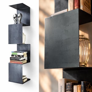 Modular suspended bookcase, H 120 cm, in raw steel | Hand-waxed natural iron | Raw Steel segment | Industrial design