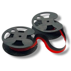 May include: Two black ribbon spools with a red accent. The spools have a unique, open design and are connected by a black and red ribbon. The spools are on a white background.