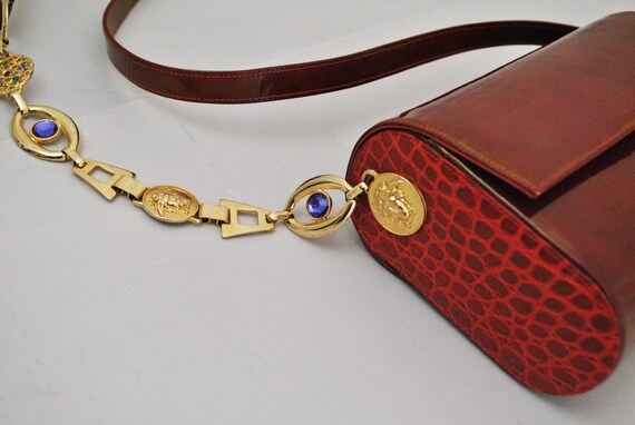red purse with gold chain