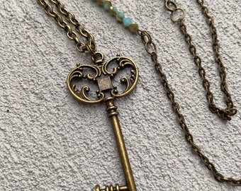 Turquoise and skeleton key necklace // long necklace with key charm and small light blue beads