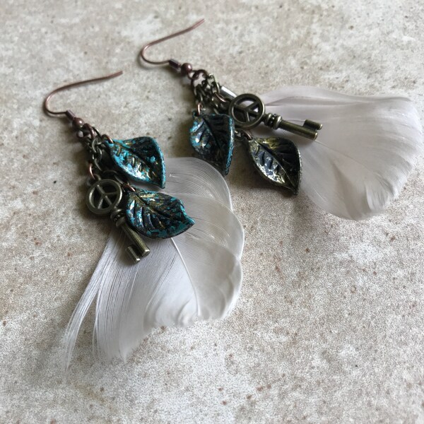 Long dangle feather earrings with key and leaf charms // fishhook feather earrings