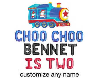 May include: A blue and red train balloon with a red star and two dogs in the windows. The text "CHOO CHOO BENNET IS TWO" is below the train. The text "customize any name" is below the text.