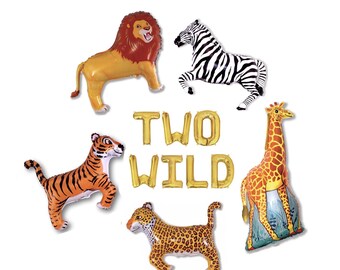 May include: A set of gold foil balloons spelling out "TWO WILD" with animal balloon decorations including a lion, zebra, tiger, giraffe, and leopard.