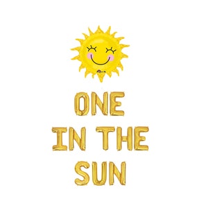 May include: A yellow sun-shaped balloon with a smiling face and the phrase "ONE IN THE SUN" in gold foil letter balloons. The balloons are on a white background, perfect for a birthday party.