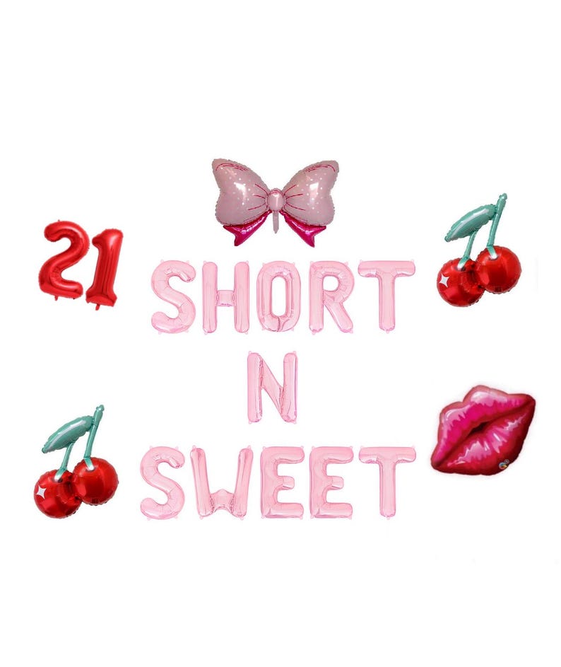 May include: Pink foil balloons spelling "SHORT N SWEET" with a red "21" balloon, a pink bow, red cherries, and a red lip-shaped balloon. Party decorations for a birthday or celebration.