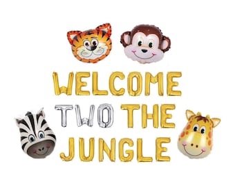 Peut inclure: Un ensemble de ballons en aluminium représentant des têtes d'animaux, dont un tigre, un singe, un zèbre et une girafe, accompagnés de lettres dorées et argentées formant l'expression WELCOME TWO THE JUNGLE pour une décoration festive.