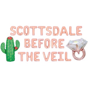 May include: Rose gold foil balloons spelling "Scottsdale Before The Veil" with a cactus and a diamond ring balloon.