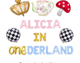 May include: A set of foil balloons including a gold crown, a floral teapot, and a red mushroom. Letter balloons spell ALICIA IN oneDERLAND in pink, gold, and blue. Two black and white chequered round balloons are included. Text reads Customize Any Name.