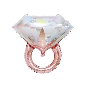 May include: A diamond ring shaped balloon featuring a large, iridescent, multifaceted gemstone top with a reflective, holographic finish and a metallic rose gold band. The design mimics the appearance of a faceted diamond set on a circular ring.