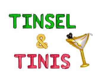 May include: A set of foil balloons spelling out the phrase TINSEL & TINIS, with the word TINSEL in green, an ampersand in gold, and the word TINIS in red. A gold martini glass balloon with a black olive garnish replaces the letter T in TINIS.