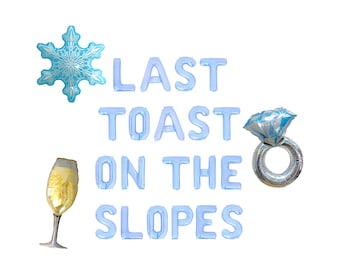 May include: A festive arrangement of party balloons in light blue, silver, and gold. The balloons spell out "LAST TOAST ON THE SLOPES" and include a snowflake, a champagne flute, and a diamond ring.