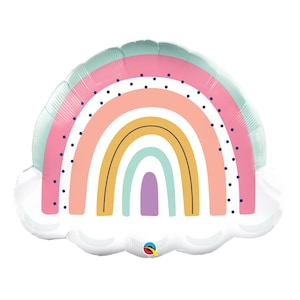 May include: A rainbow-shaped balloon with a cloud base. The rainbow has layers of pink, peach, yellow, and light blue, with a purple arch at the bottom. Small blue dots decorate the pink layer. A cheerful party decoration.