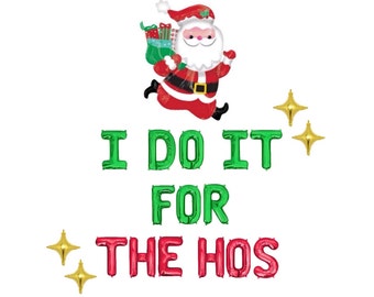May include: A graphic design featuring a cartoon Santa Claus carrying a green sack of gifts above the text I DO IT FOR THE HOS, rendered in green and red foil balloon-style lettering, accented by four gold four-pointed star-shaped foil balloons.