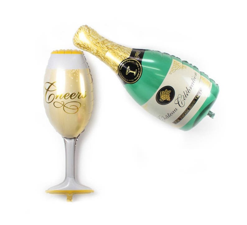 May include: Gold foil balloon shaped like a champagne glass with the word "Cheers" printed on it.  A green and gold foil balloon shaped like a champagne bottle with the text "Chateau Celebration" printed on it.