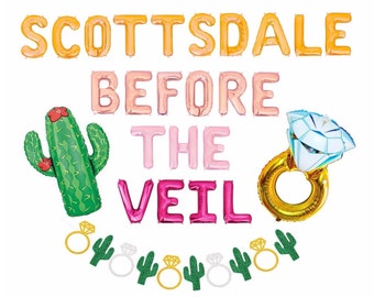 May include: A set of foil balloons spelling SCOTTSDALE BEFORE THE VEIL in orange, light pink, and hot pink. Includes a green cactus balloon with red flowers, a gold ring balloon with a diamond, and a garland of small ring and cactus cutouts.