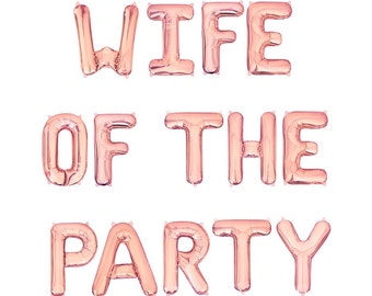 May include: Rose gold foil balloons spelling out "WIFE OF THE PARTY" against a white background. The balloons are inflated and arranged in three lines, perfect for a bachelorette party or bridal shower.
