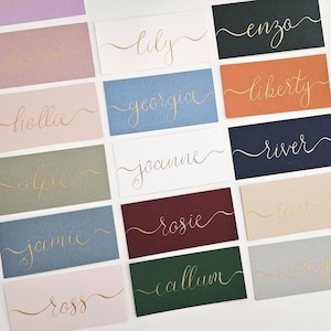Handwritten Coloured Flat Wedding Place Names with Glyphs | Gold Ink Handwritten Calligraphy | Gold Name Cards | Place Card | Seating Plan