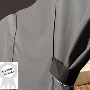 May include: A gray fabric cover with black trim and the text "Economy Package" on a white label. The cover is designed to protect outdoor furniture.