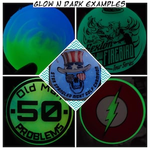 May include: A collage of five glow-in-the-dark disc golf discs. The discs feature various designs, including a skull with sunglasses, a lightning bolt, a firebird, and a design with the text "Old Man 50 Problems".