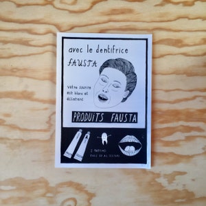 May include: Black and white illustration of a person with a wide open mouth, showing teeth. The text reads "avec le dentifrice FAUSTA" and "PRODUITS FAUSTA".  The illustration is a vintage style advertisement for toothpaste.