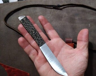 Simple leather sheathed neck knife.