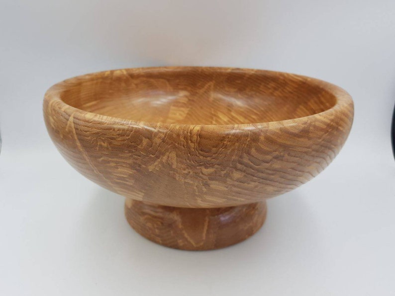 Wood Footed Fruit Bowl. Wooden fruit bowl made from a beautiful piece of Olive Ash. Very decorative grain patterns. Sustainably sourced image 1