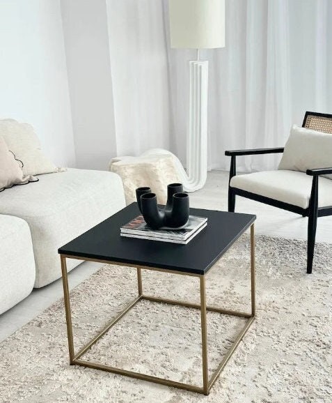 YEN II - a simple gold coffee table with a black top, coffee bench, coffee table