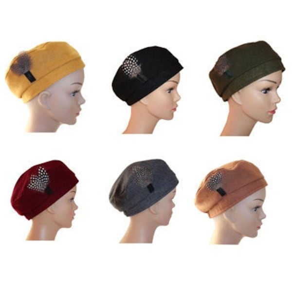 Wool cheesecloth berets accented with real feathers, six colors to choose from