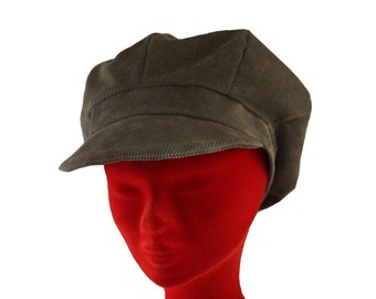 May include: A gray corduroy newsboy cap with a wide brim. The cap is on a red mannequin head.