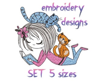 May include: Embroidery design of a girl reading a book with two cats, one blue and one orange, on her head. The design is available in five sizes. The text "embroidery designs" and "SET 5 sizes" is also included in the image.