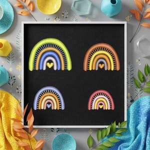May include: Four embroidered rainbow designs with heart accents on a black background, framed in white. The rainbows feature various color combinations, including green, blue, orange, and pink. The image is styled with decorative elements like leaves and bowls.