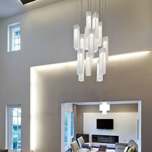 Modern Light Fixtures for a Staircase Chandelier, consist of Large Pendant Lights, designed to fill High Ceiling Foyer in Art and Beauty.